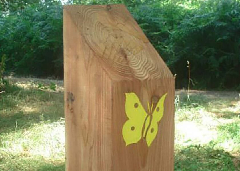 wooden foot path sign for parks